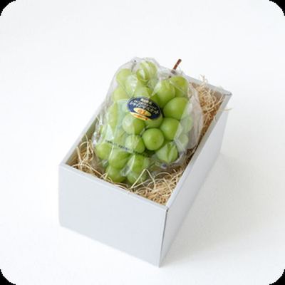 Shine Muscat grapes in a box